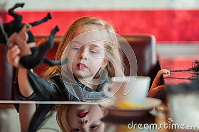 Child girl playing toy horse indoors. Childhood child toys Stock Photo