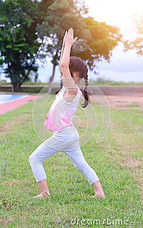 Child girl practicing Yoga pose Stock Photo