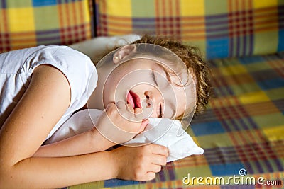 Child girl sleeping bed in retro vintage quilt Stock Photo