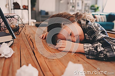 Child girl sleeping while doing homework. School kid learning hard and get tired Stock Photo