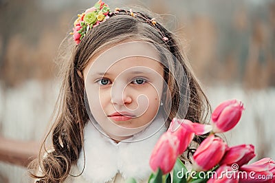 Child girl on warm winter forest walk, soft toned Stock Photo