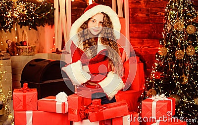 Child with gorgeous long hair celebrating new year. Pick up perfect present. Boxing day. Happy holidays. Girl celebrate Stock Photo