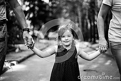 Child with grandparents in a park. Happy childhood. Black and white photo. Stock Photo