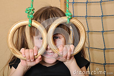 Child with gymnastic rings Stock Photo