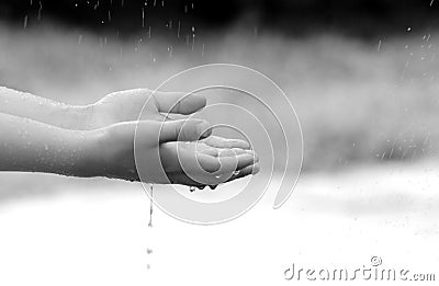 child hand holding water Stock Photo