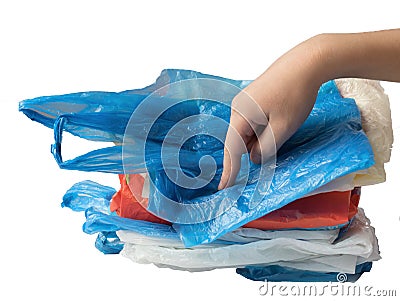 Child hand presses down plastic bags Stock Photo
