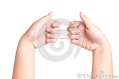 Child hand playing with elastic rubber band isolated on white Stock Photo