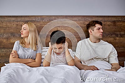 Child has emotional stress and a broken psyche after quarrels of parents Stock Photo