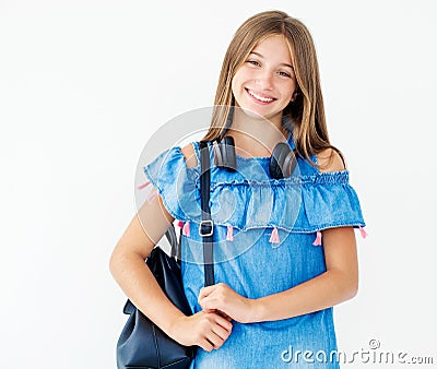 Child with headphones and backpack Stock Photo