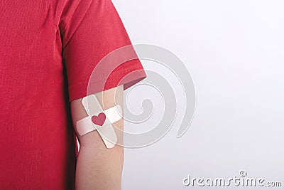 Child with a heart drawn on his arm. Blood donation concept Stock Photo