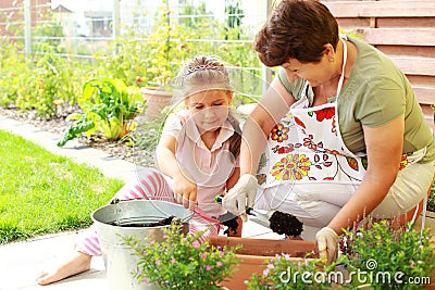 Child helps by replanting Stock Photo