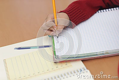 Boy in classroom learning and in concertrated moment Stock Photo