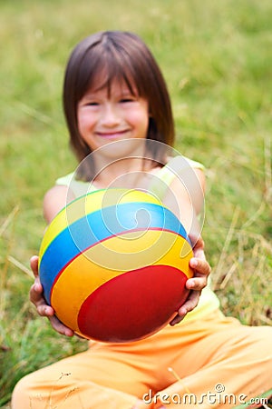 The child hold a ball Stock Photo