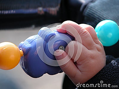 Child Holding a Toy Stock Photo