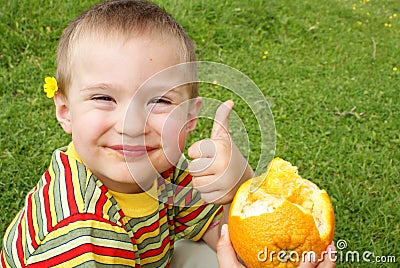 The child holds nadkusanny orange Stock Photo