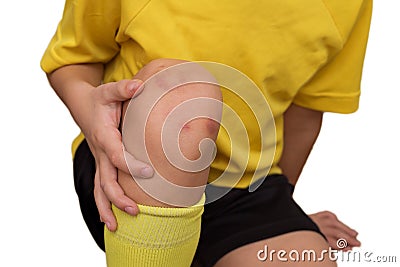 Child hurt his knee while playing football. Stock Photo