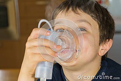 Child with inhaler mask Stock Photo