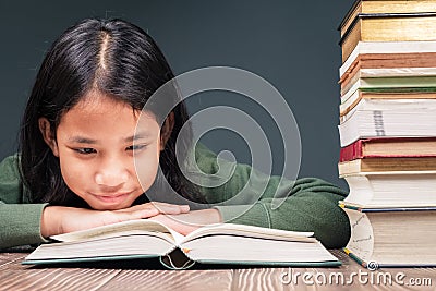 Child Intend to Read the Book Stock Photo