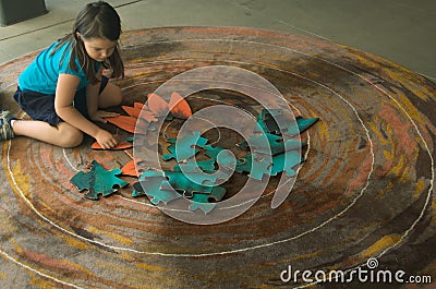 Child with jigsaw puzzle Stock Photo