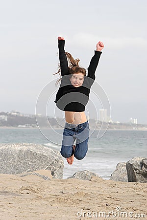 Child Jumping for Joy Stock Photo