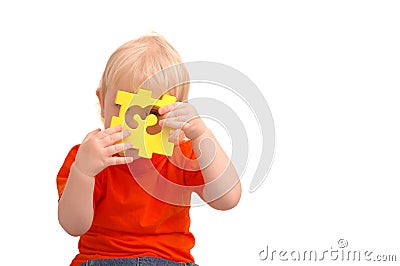 Child keeps puzzle with numeral and Stock Photo