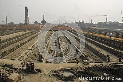 Child labor working with workers in a break filed Editorial Stock Photo