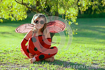 Child in ladybug costume Stock Photo