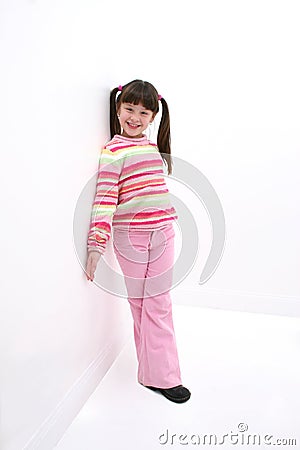 Child Leaning Against the Wall Stock Photo