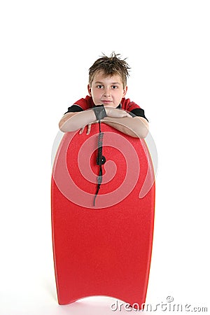 Child leaning on a bodyboard Stock Photo