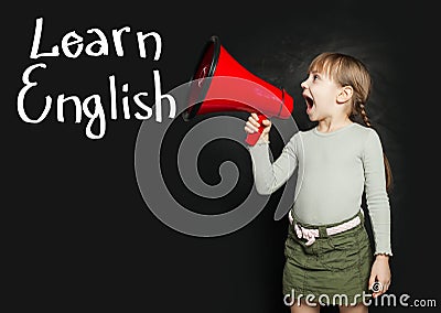 Child learning English language and screaming through a megaphone Learn English Stock Photo