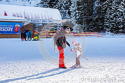 The child learning to ski and man on the slope Editorial Stock Photo