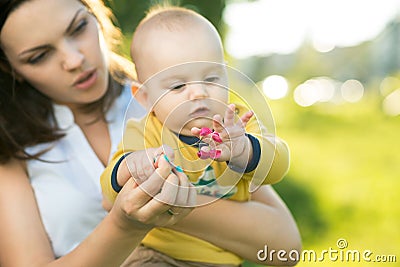 Child learns a little flower Stock Photo