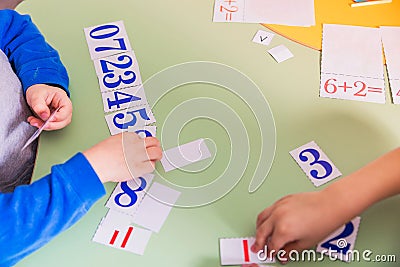 The child learns to count by adding numbers Stock Photo