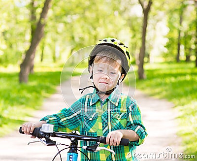 Child learns to ride a bike Stock Photo