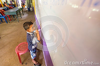 Child in lesson at school by project Cambodian Kids Care Editorial Stock Photo