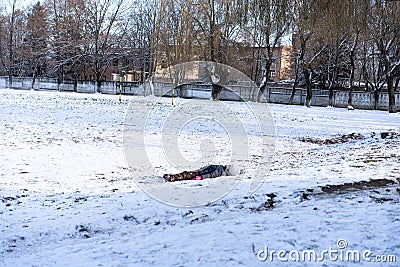 The child lies in the snow Stock Photo