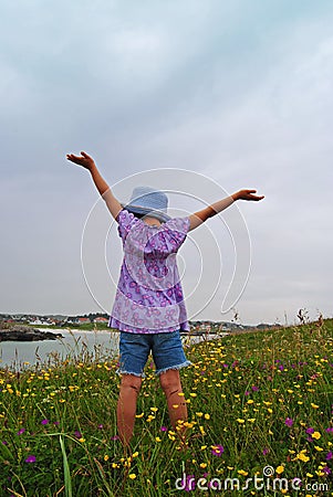 Child lifting hands Stock Photo