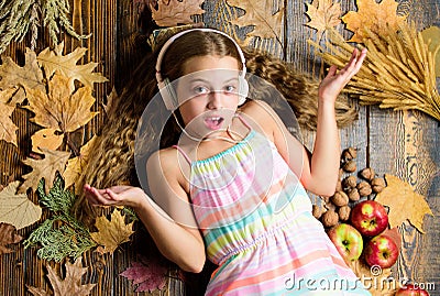 Child listen music relaxing top view. Autumn music playlist. Best songs about fall. Enjoy music and relax. Happy Stock Photo