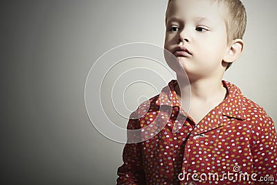 Child.Little Boy in Red Shirt.Serious Kid Stock Photo