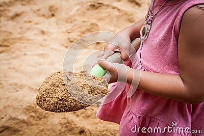 Child little girl holding sand shovel Stock Photo