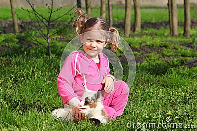 Child and little goat pet Stock Photo