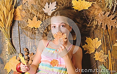 Child long hair with dry leaves. Tips for turning autumn into best season. Autumn coziness is just around. Coziest Stock Photo