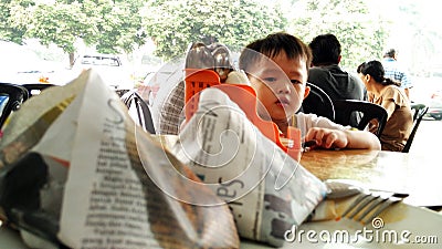 Child looking at Nasi Lemak Food in Malaysia Editorial Stock Photo