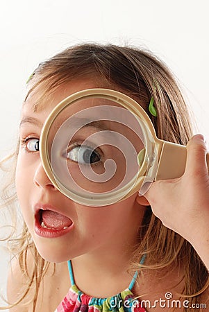 Child with magnifying glass Stock Photo