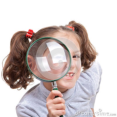 Child with magnifying spy glass Stock Photo