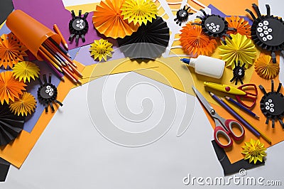 The child makes black spiders of paper. Master Class. Handmade crafts. Stock Photo