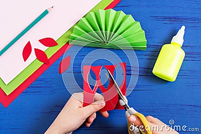 Child makes gift to March 8 or Mother`s Day. Step 5 Stock Photo