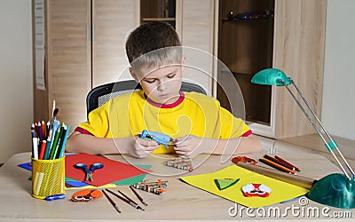 Child making Christmas decorations. Make christmas decoration with your own hands. Stock Photo