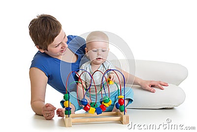 Child and mother play with educational toy Stock Photo