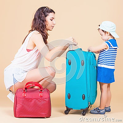 Child with mother ready to travel to Europe, Milan Stock Photo